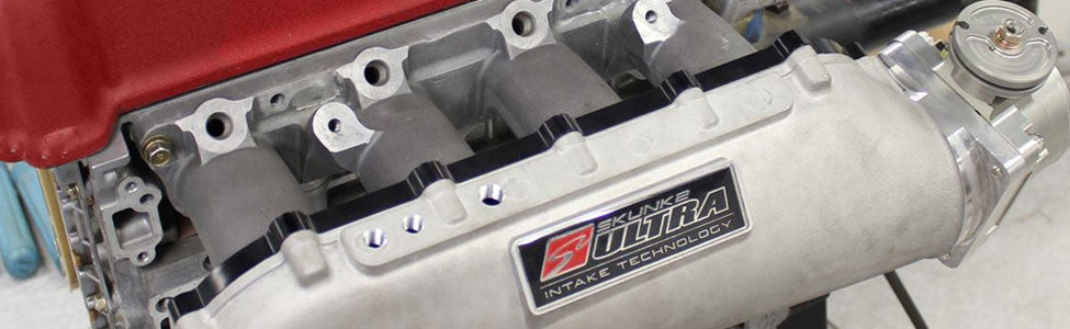 Performance cold air intake system with high-flow air filter and aluminum piping, designed to increase horsepower and improve engine efficiency.